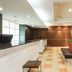 Hotel Mystays Sakaisuji Honmachi lobby in Osaka with reception desk, seating bench and modern lighting