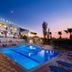 Oasis Scaleta Hotel in Skaleta with outdoor pool terrace at sunset and sea-facing balconies