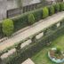 Sudha's Garden Home Kathmandu garden courtyard with manicured hedges, lawn, and walkway