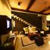 Le Jardin Villas Seminyak in Kuta: open-plan villa living room with staircase, seating area and dining table