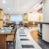 Gh Galeria in Guayaquil restaurant with set dining tables, curved bar, and bright modern interior