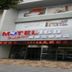 Sky Bird Hotel - Shanghai Hongqiao Airport entrance in Shanghai with glass doors and motel sign