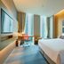 Aloft Seoul Gangnam guest room with city-view windows, desk, and king bed in Seoul