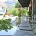 Chalay Monta Hua Hin outdoor water feature with stepping stones, tropical plants, and mountain view