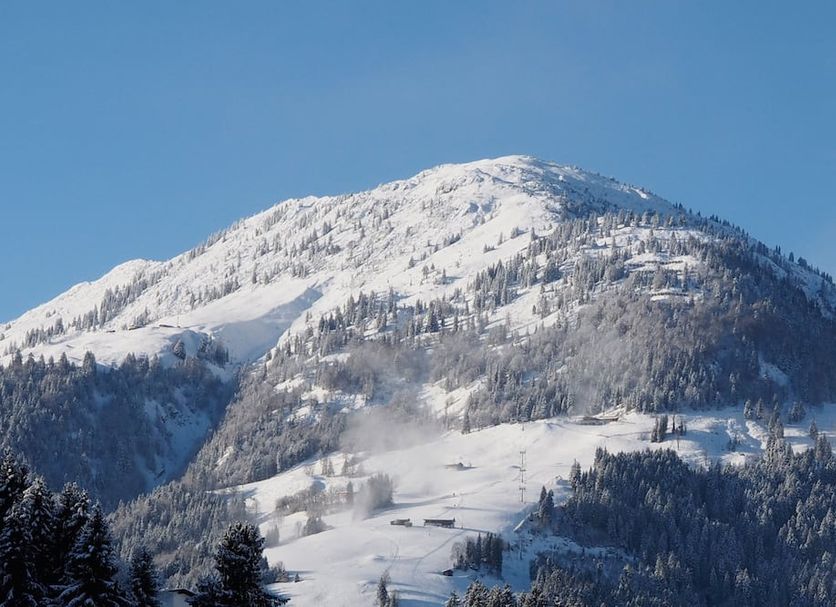 Haus Tannenhof Pension in Kirchberg in Tirol with snow-covered mountain view