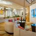 Fort Lauderdale Marriott Coral Springs Hotel & Convention Center lobby seating with blue wall art in Coral Springs