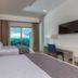Krystal Puerto Vallarta guest room with two beds and ocean-view balcony