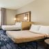 Fairfield Inn & Suites by Marriott Fairfield Napa Valley Area room with two beds, desk and window seating