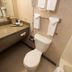 Quality Inn Rosebud Casino bathroom with toilet, sink vanity, mirror and towels in Mission