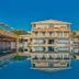 Mavrikos Hotel in Tsilivi with a large outdoor pool reflecting the hotel building and balconies