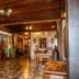 Tiradentes Village in Tiradentes lobby with wooden ceiling, checkered floor, stained glass windows, and rustic decor