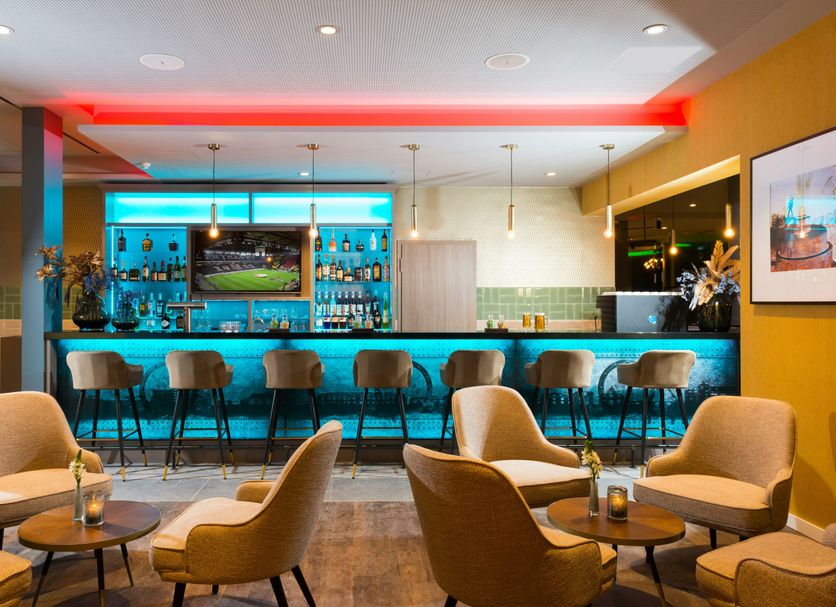 Leonardo Hotel Offenbach Frankfurt lounge with illuminated bar and seating in Offenbach am Main