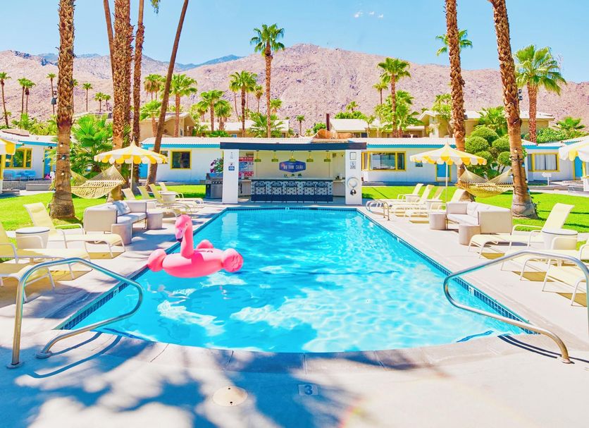 A Place In The Sun - Adults Only in Palm Springs: palm-lined outdoor pool with mountain backdrop