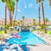 A Place In The Sun - Adults Only in Palm Springs: palm-lined outdoor pool with mountain backdrop