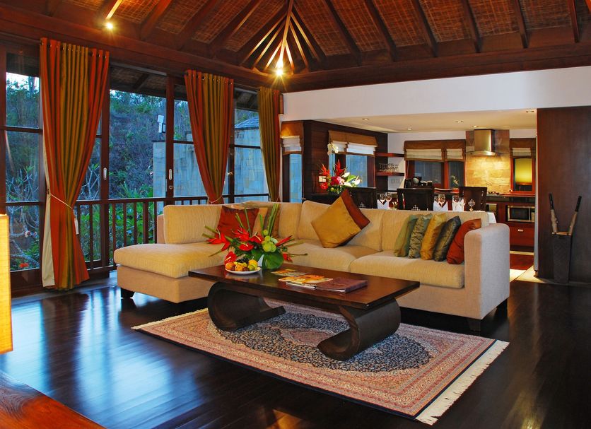 Gending Kedis Luxury Villas & Spa Estate in South Kuta living room with sectional sofa and tropical view