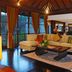 Gending Kedis Luxury Villas & Spa Estate in South Kuta living room with sectional sofa and tropical view