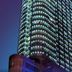 Shangmao International Hotel in Nanjing, illuminated high-rise tower against the evening sky