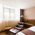 James Joyce Coffetel San Yuan LI Station in Guangzhou, guest room with leather lounge chair and window seating