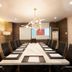 Lenox Hotel in Dagupan City meeting room with long conference table, black chairs, projector and screen