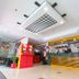 Hotel Sogo Quezon Avenue lobby in Manila with front desk, red kiosk, and modern ceiling lighting