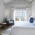 Cheval Blanc St-Barth bedroom in Gustavia with ocean-view balcony and coastal decor