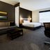 Hyatt Place Augusta guest room with sofa, king bed, desk and large window
