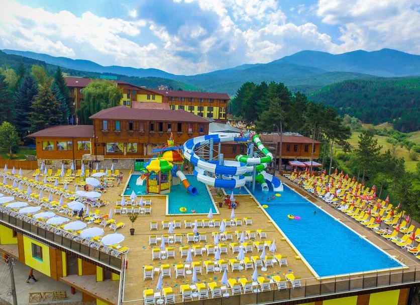Spa Hotel Elbrus in Velingrad with outdoor pool, water slide, sun loungers and mountain views