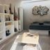 Radio Tulum room with bed, shelving, and wall mirror in Tulum
