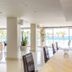 Vrissiana Boutique Beach Hotel in Protaras dining area with ocean views and floor-to-ceiling windows