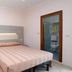 Hotel Concorde Cesenatico room with double bed, sofa, and ensuite bathroom