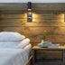 Diamond's Hotel, Zakopane: twin beds with wood headboard, bedside table and wall lights