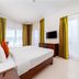 Star Metro Deira Hotel Apartments Dubai guest room with king bed, TV, and large windows