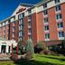 Hilton Garden Inn Auburn Lewiston Riverwatch in Auburn exterior with landscaped courtyard and patio