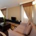 The Apartments, Dubai World Trade Centre living room in Dubai with sofa, armchairs, TV and dining area