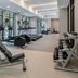 Courtyard by Marriott Olympia fitness room with treadmills, weight bench and dumbbells