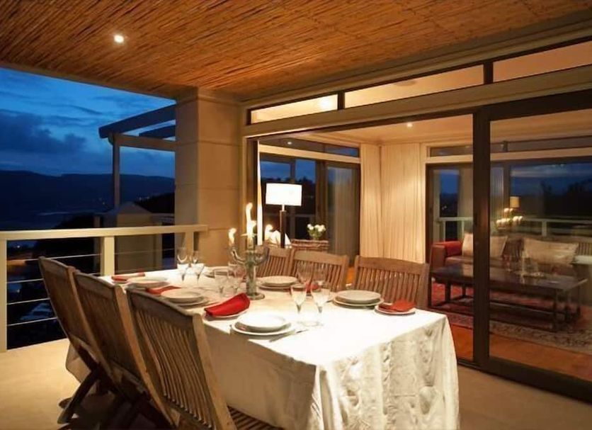 Kanonkop House in Knysna, candlelit balcony dining with mountain and sunset views