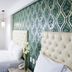 Hotel Casino Plaza Guadalajara guest room with twin beds and patterned green accent wall