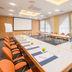 Best Western Plus Hotel Am Schlossberg meeting room in Nuertingen with U-shaped conference table and projector screen