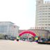 Lvjing International Hotel in Taizhou with tall facade and colorful entrance arch