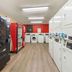 Extended Stay America Suites - Bakersfield - California Avenue laundry room with washers, dryers and vending machines