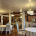 Villa Silvina Hotel And Restaurant in Baguio dining room with chandeliers and round tables