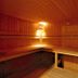 Residence Plein Soleil in Villarodin-Bourget sauna interior with wooden benches and warm lighting