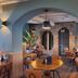 Fletcher Hotel-Restaurant La Ville Blanche in Thorn, cozy restaurant with arched doorway and brick wall