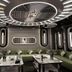 Master Hotel Huizhou lounge with olive-green sofas, marble tables and futuristic circular ceiling lights