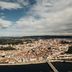 Stay Hotel Coimbra Centro overlooks Coimbra and the river with a bridge, cityscape, and hills beyond