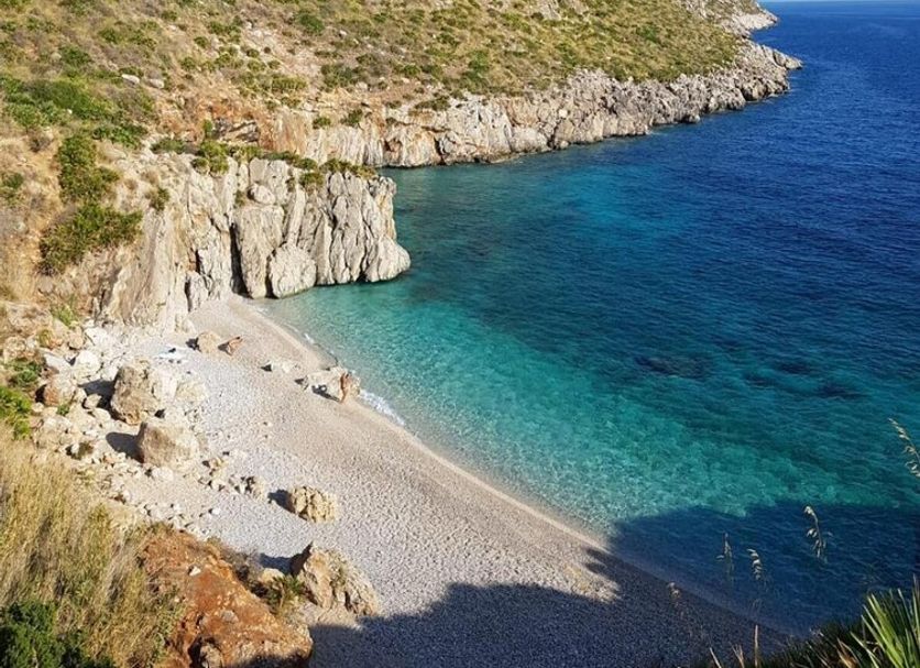 Cala di Ponente in Castelluzzo with cliffside sea views over a rocky cove and turquoise water