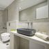 Oniropetra Apartaments bathroom in Plintri with walk-in glass shower, wall-hung toilet and vessel sink