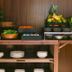 Hôtel Des Grands Voyageurs Paris breakfast buffet with fruit, pastries, salads, and stacked bowls
