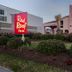 Red Roof Inn Virginia Beach - Norfolk Airport exterior with illuminated signs and landscaped entrance