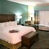 Hampton Inn Pittsburgh-Bridgeville room with king bed, TV, desk, chair and window with curtains in Bridgeville